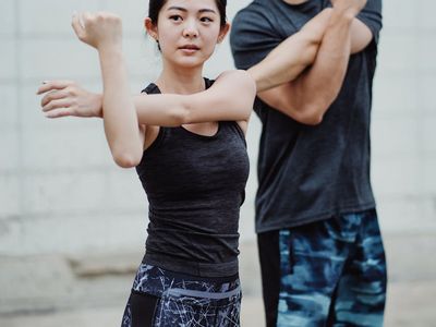 Person doing dynamic arm movements for cardio health.